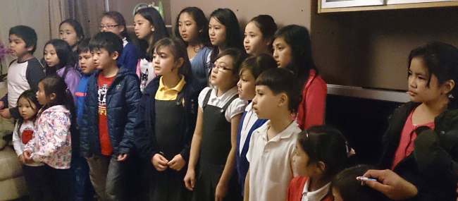 Creative Hearts United. Filipino children in Choir rehearsal for the Philippine typhoon appeal charity concert