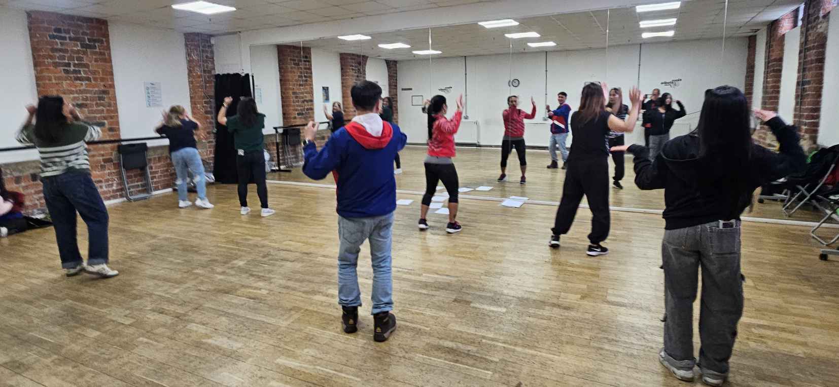YFG Cultural Dance Troupe rehearsing at a dance studio YFG Cultural Dance Troupe rehearsing at a dance studio