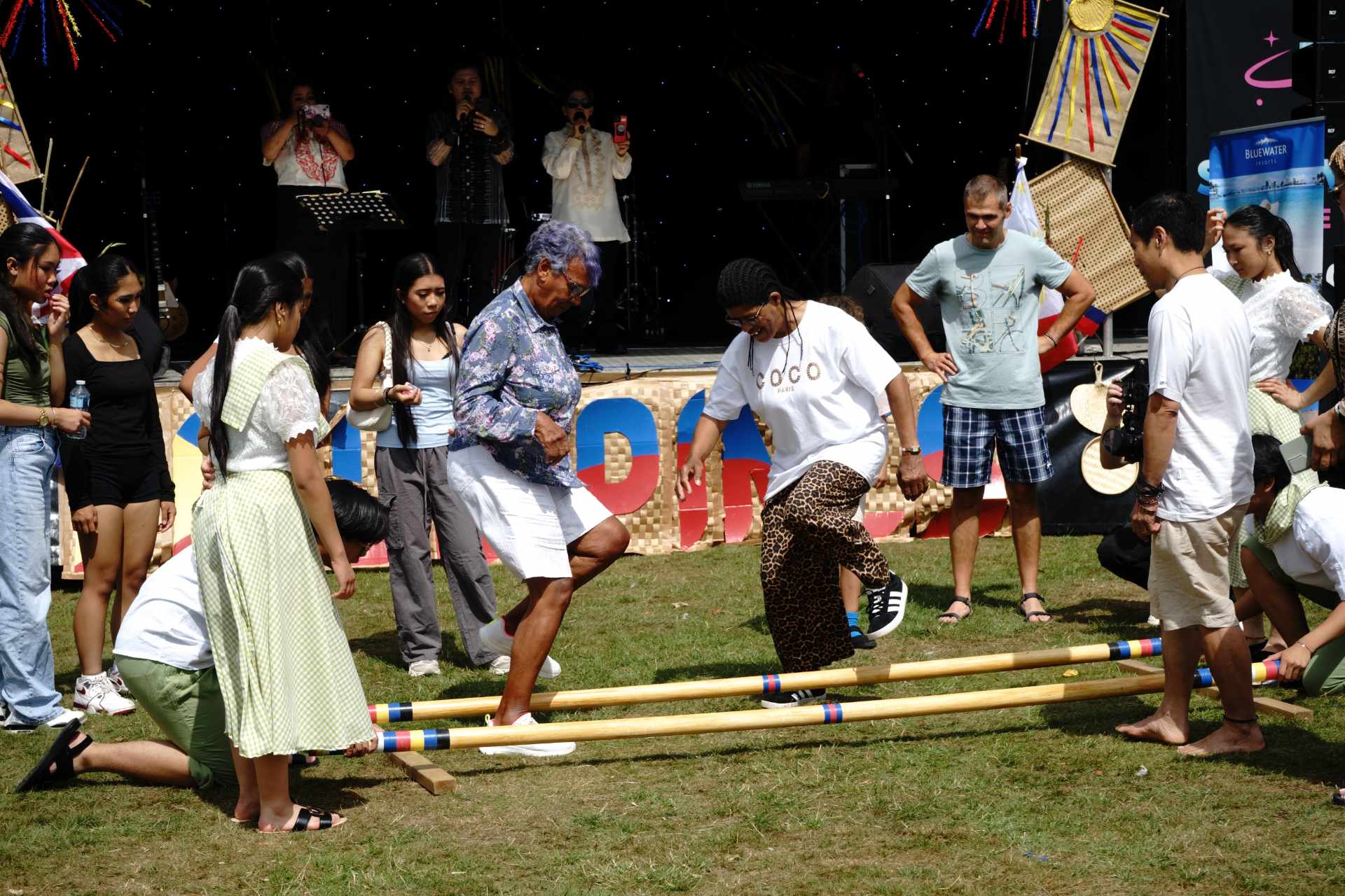 First-time dancers from the audience join the Tinikling, discovering the fun and challenge of this iconic Filipino folk dance.