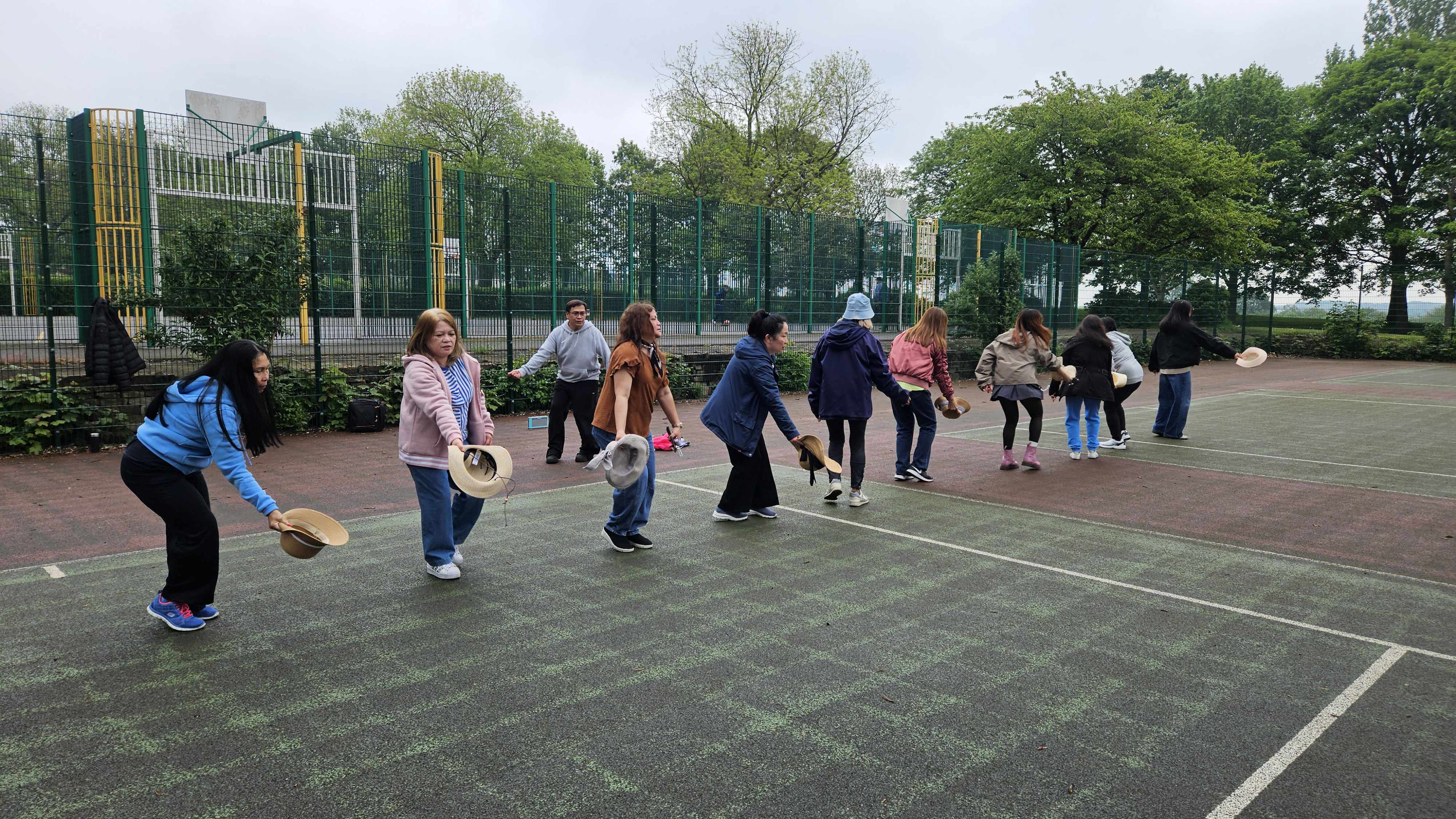 Even in gloomy weather, the dancers bring their own sunshine.