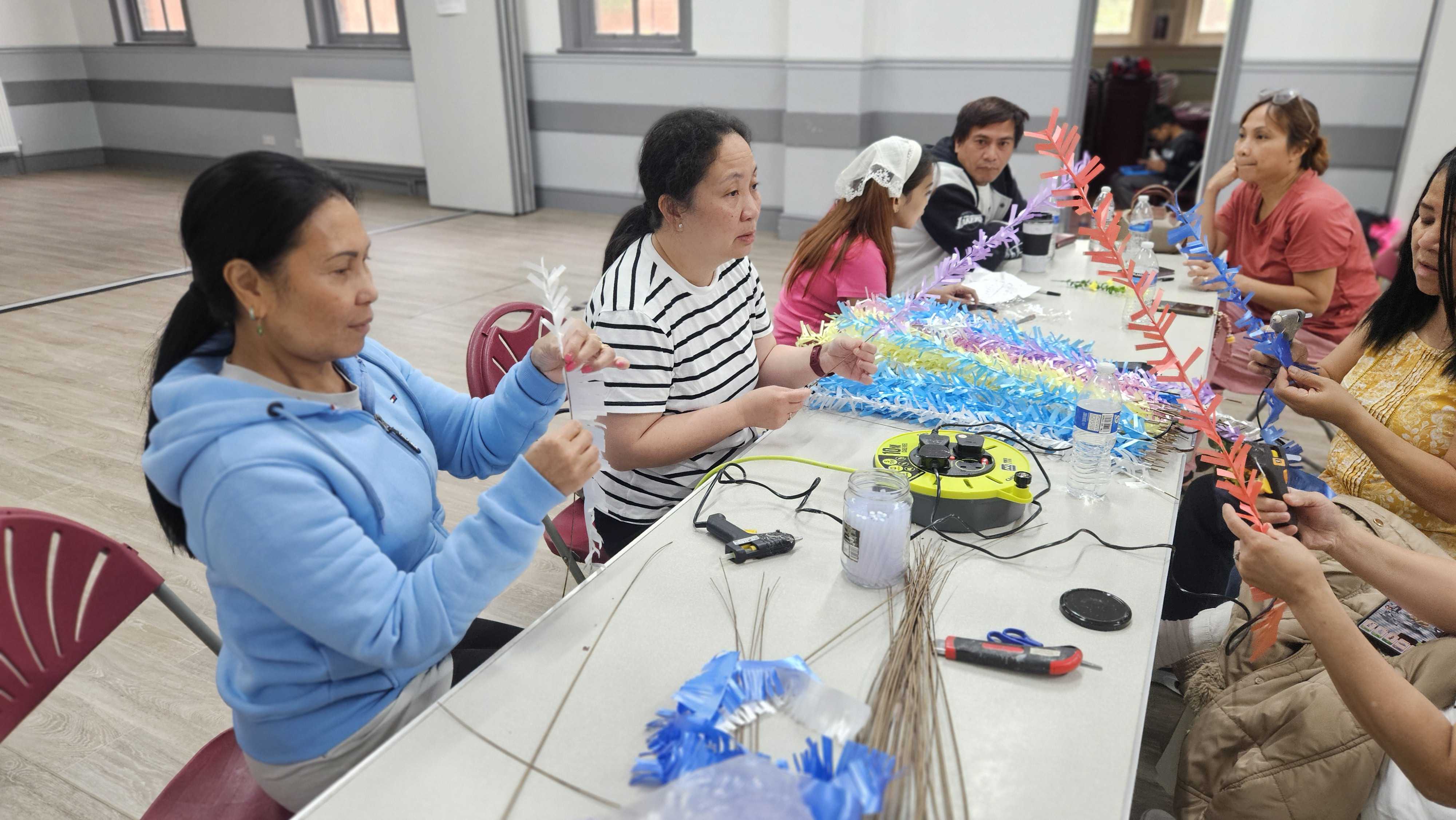 Making Bunga Mangga folk dance props.