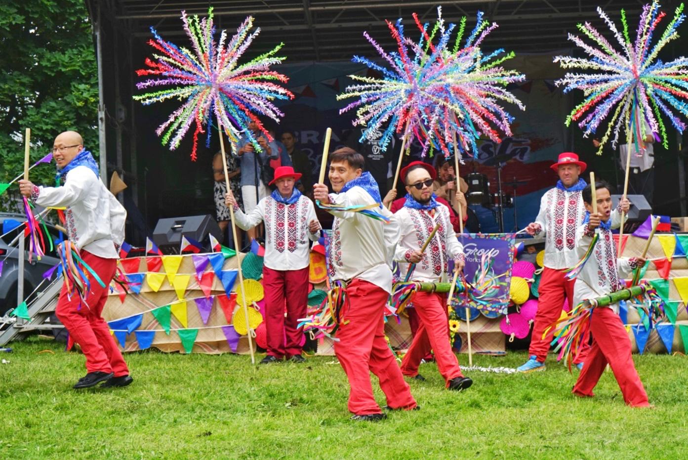 Performers highlight the lively Karatong folk dance, moving in sync with the beat of their bamboo waist drums.